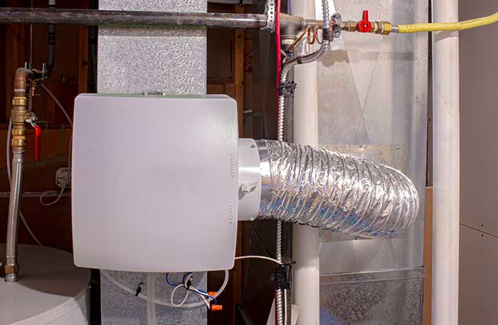 Duct-mounted whole-house humidifier installed