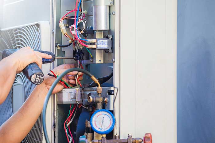 Heating system maintenance by technician