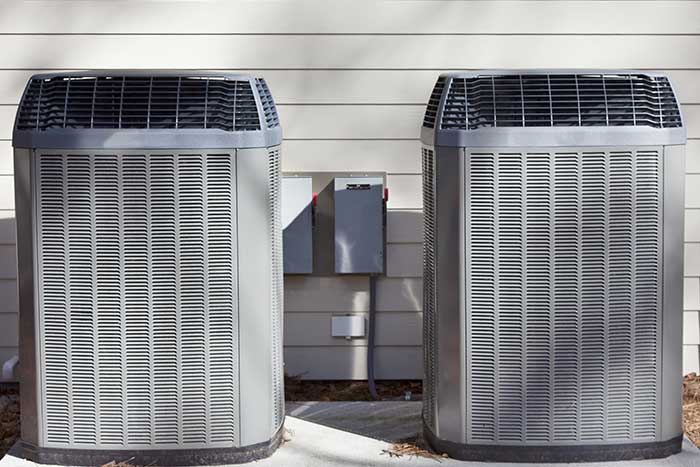 Dual heat pump installation outside home