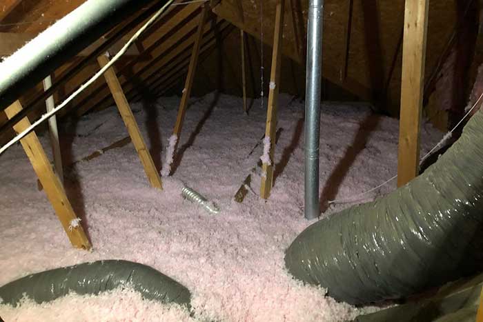 Blown-in attic insulation installation