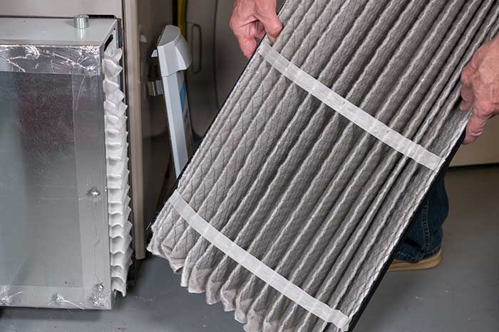 Air filter replacement in progress