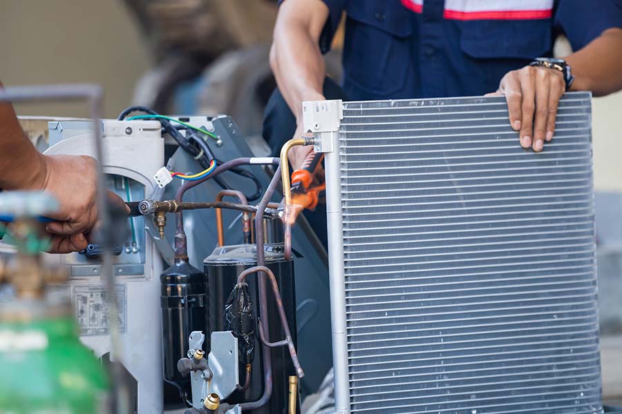 Technicians working on AC repair